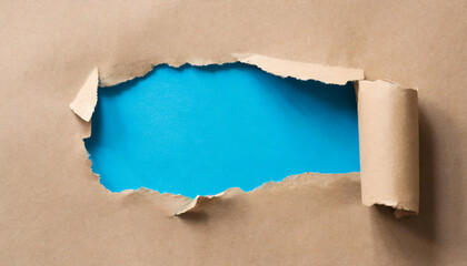  Torn hole in craft paper with blue copy space