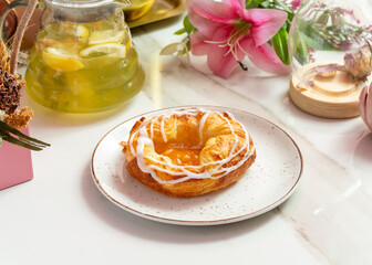 Pastries, homemade bun with apricot jam and cream.
