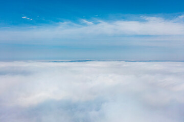 Aerial view of the city in the fog. Skyscrapers above the fog