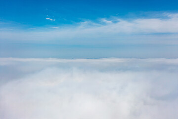 Aerial view of the city in the fog. Skyscrapers above the fog