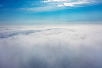 Aerial view of the city in the fog. Skyscrapers above the fog