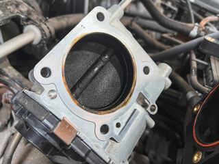 Electronic throttle body covered with carbon deposits can cause bad idling and MPG of the car or truck.