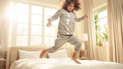 Fototapeta na wymiar A young Asian boy 7 years old enjoying music in her cozy living room, wearing headphones and dancing with a carefree and joyful expression, capturing the essence of a relaxed and stylish lifestyle