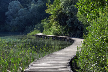 Fototapeta na wymiar Path over a mountain lake. Plitvice lakes. Nature background. Selective focus