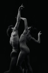 Passion, inspiration and feelings. Talented, artistic young man and woman, ballet dancers making performance, dancing. Monochrome. Concept of classic art, aesthetics, emotions, ballet dance, talent