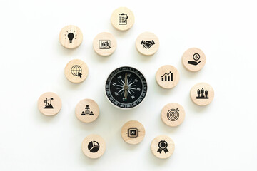 A compass is placed in the center, surrounded by wooden blocks with business icons. navigation compass defines marketing direction and analyzes growth sales data and strategy. Business Opportunity - obrazy, fototapety, plakaty