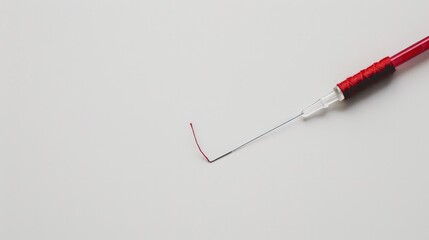 thread lying on a clean white background, epitomizing the essence of sewing
