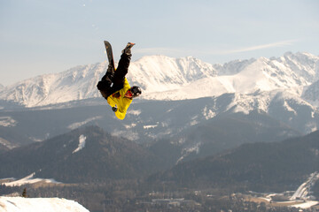 Skier jumping in the mountains