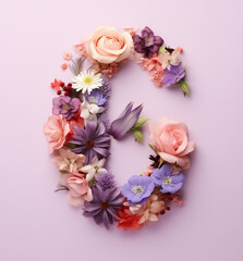 Number six made of blue, pink, orange, purple flowers on light pink background. Spring concept.