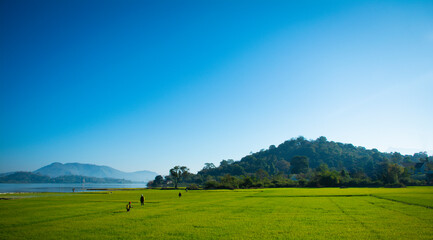 Landscape of the sun slowly rising from the mountain. Morning sunrise at Vietnam's Lak Lake.