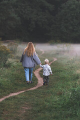 mother and child walking in the park
