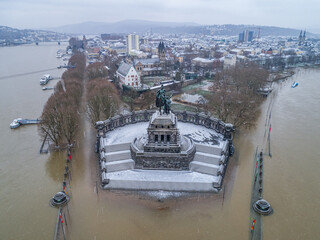 Flooding high water Koblenz Germany historic monument German Corner winter where rivers rhine and mosele flow together - 740593732