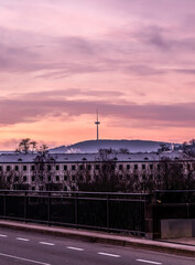 Colorful Sunset over huge transmitter tower above German town Koblenz and the Middle Rhine valley - 740594751