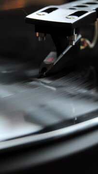 Extreme close-up vinyl record spinning with a gramophone needle on the disc