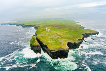 Loop Head Lighthouse, located south-east of Kilkee, on the northern Dingle Peninsula, on the cliffs...