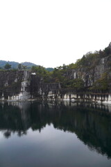 Fototapeta na wymiar 石切山脈（いしぎりさんみゃく）は日本の茨城県笠間市にある日本最大の稲田石の採石場。