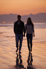 Couple, holding hands and walking on beach for sunset, nature and travel with bonding for love and...
