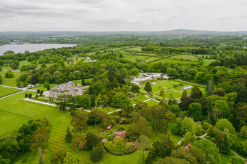 Aerial view of Muckross House, furnished 19th-century mansion set among mountains and woodland in Killarney National Park, county Kerry, Ireland.