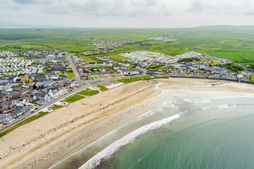 Kilkee, small coastal town, popular as a seaside resort, located in horseshoe bay and protected...