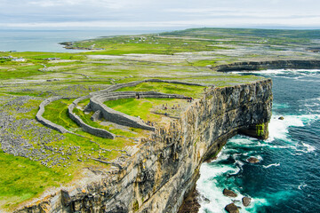 Dun Aonghasa or Dun Aengus, the largest prehistoric stone fort of the Aran Islands, popular tourist attraction, important archaeological site, Inishmore island, Ireland - obrazy, fototapety, plakaty