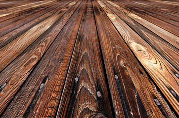 Drewniana podłoga z desek w brązowym kolorze z widocznymi sękami  i słojami w perspektywie zbieżnej, tło, tapeta, tekstura