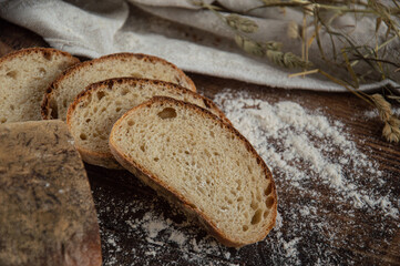 Fresh sliced wheat-rye bread on a light table