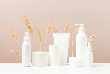 Cosmetic products on the table, white bottles and containers, mock-up scene