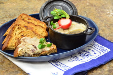 Creamy pork liver pate served with toasted bread.