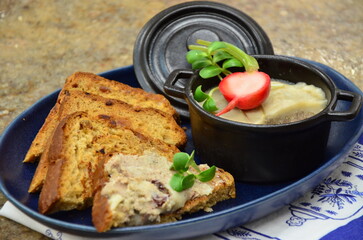 Creamy pork liver pate served with toasted bread.