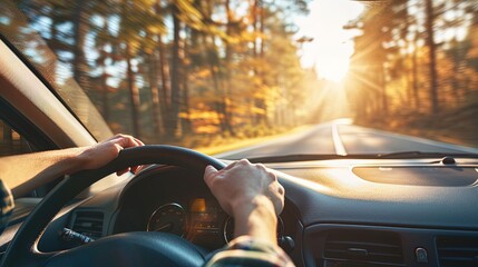 Hands of a car driver gripping the wheel, navigating the road, driving