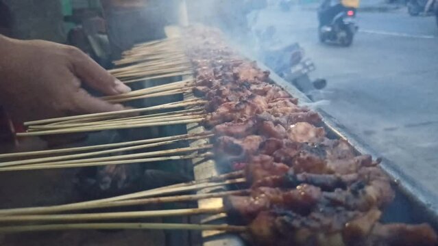 Indonesian Traditional Food: grilling typical Madurese satay