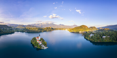 Drone point view of Church and Castle in lake Bled, Slovenia at sunset, scenic autumn panorama,...