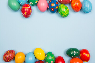 Colorful easter eggs on pastel blue background