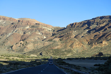 Obraz premium Road to El Teide National Park. Volcano crater road trip. View from car window