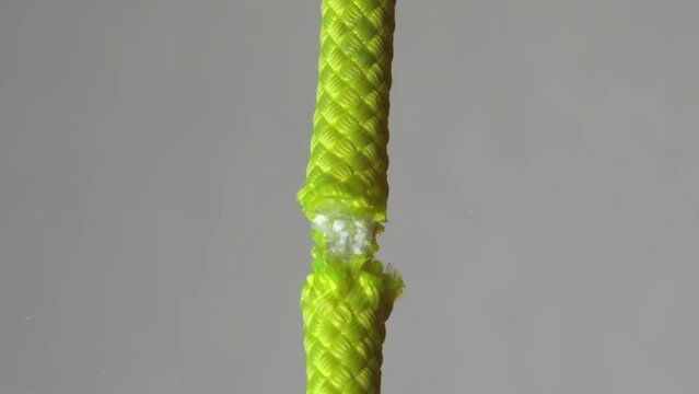 cutting
alpine rope, alpine rope rupture, thick rope paresis, climbing rope cut with a knife, Slow motion