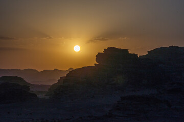 Jordan, Wadi Rum desert. Sunset with incredible landscapes in vibrant colors from all sides....
