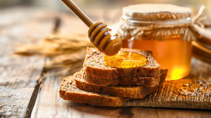 Wooden spoon with sweet honey, full glass jar on a wooden board on the kitchen table next to the homemade whole grain wheat cereal bread slices. Organic foods dessert meal, delicious breakfast