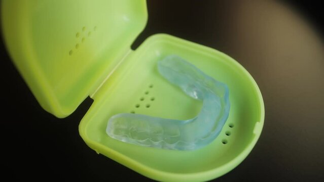 Mouthguard for teeth on dressing table. Dental healthcare and Orthodontic concept.