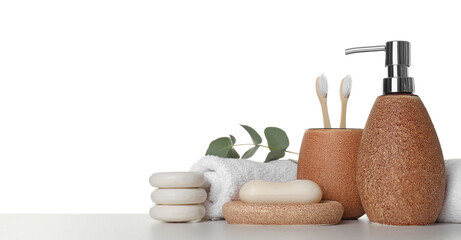 Bath accessories. Different personal care products and eucalyptus branch on table against white background. Space for text