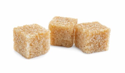Three brown sugar cubes isolated on white