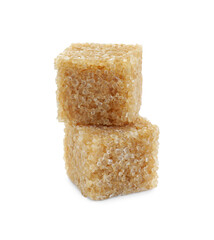 Two brown sugar cubes isolated on white