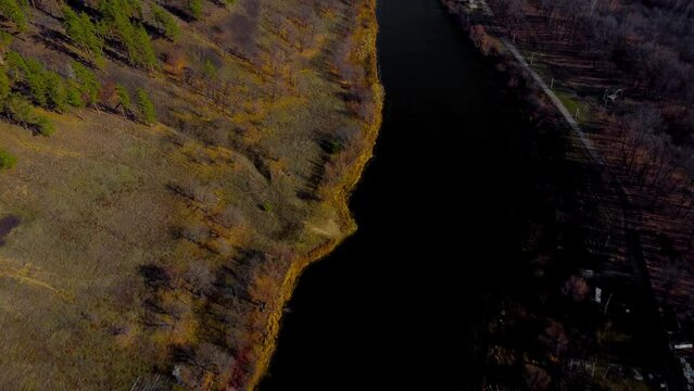 Autumn Tapestry Aerial Views of Russia Nature Drone Footage Over Volga River, Forest, and Mountains. Grushinsky Festival Meadow in Warm Glow