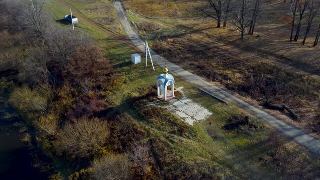 Autumn Tapestry Aerial Views of Russia Nature Drone Footage Over Volga River, Forest, and Mountains. Grushinsky Festival Meadow in Warm Glow