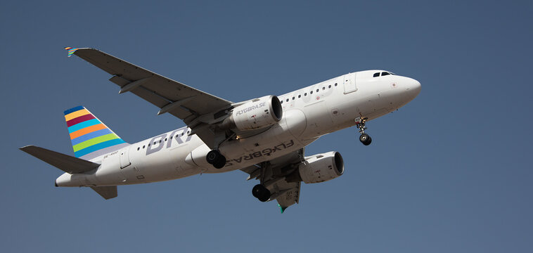 Tenerife, Spain February 18 st, 2024. Airbus A319-112 Braathens Airlines flies in the blue sky. Landing at Tenerife Airport