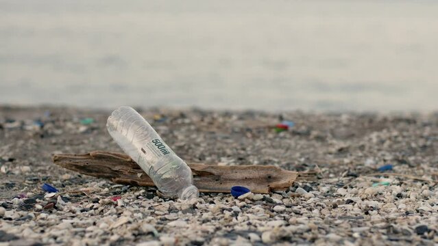 Empty bottle thrown on khasab beach, image of environmental pollution