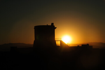 Silhouette of Torreon de San Miguel at Sunset