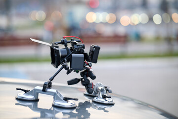 A professional camera rig is mounted on a vehicle, ready for filming cinematic projects and...