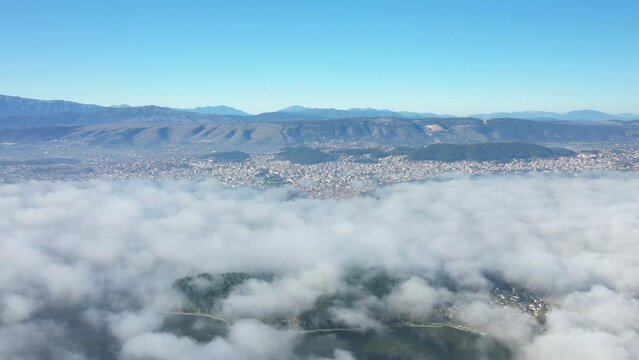The island of Ioannina below the clouds in Europe, Greece, Epirus in summer on a sunny day.