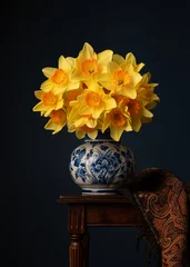 Fototapeten Still life with a bouquet of daffodil flowers in a delft blue vase on a dark blue background © Elles Rijsdijk