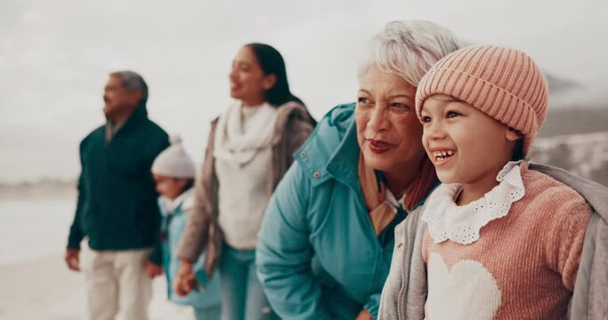 Big family, beach and grandmother with girl, vacation and excited with happiness and getaway trip. Old woman, seaside and children with holiday and bonding together with generations and adventure